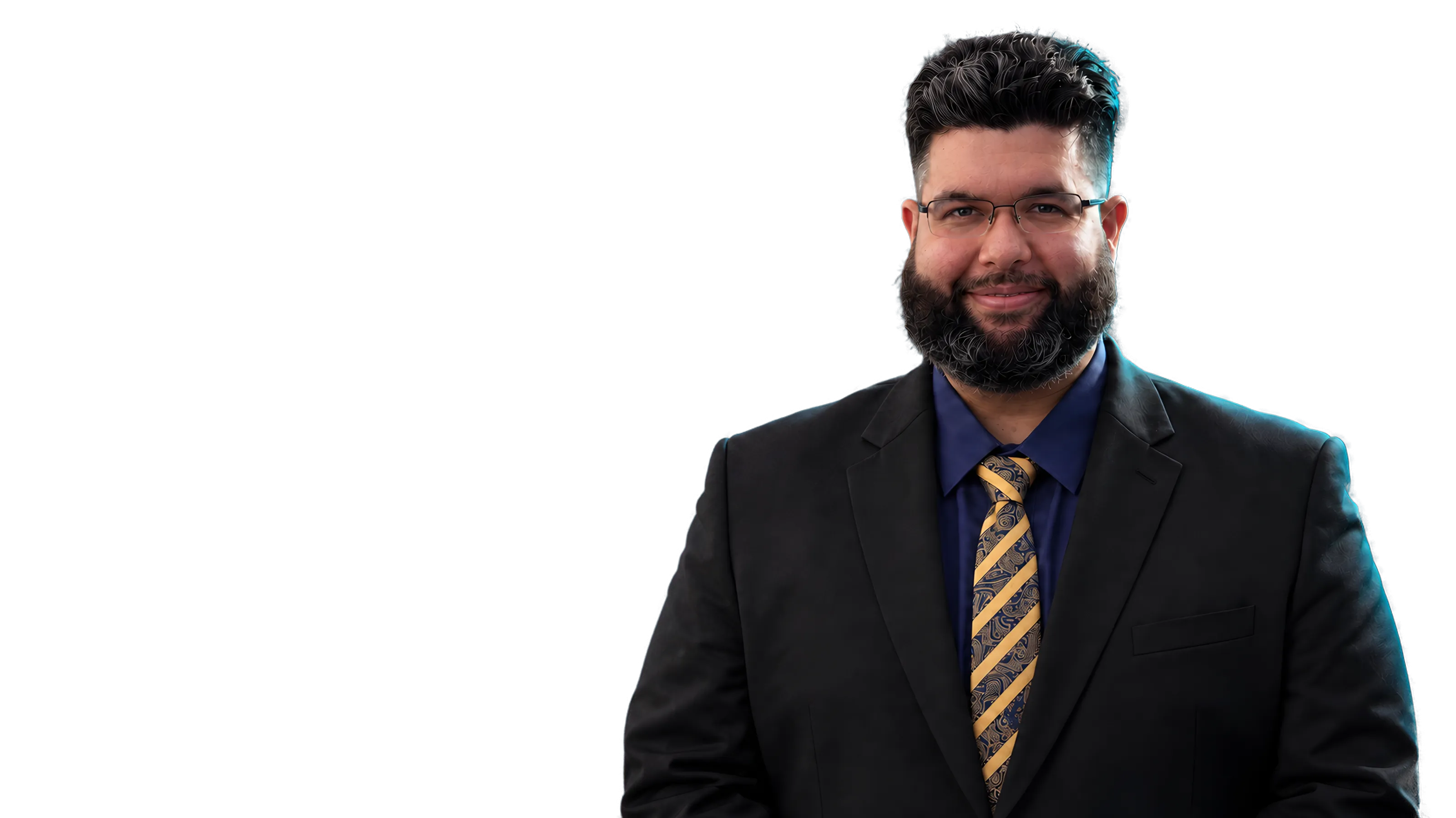 Wilder in a dark suit against a teal studio background